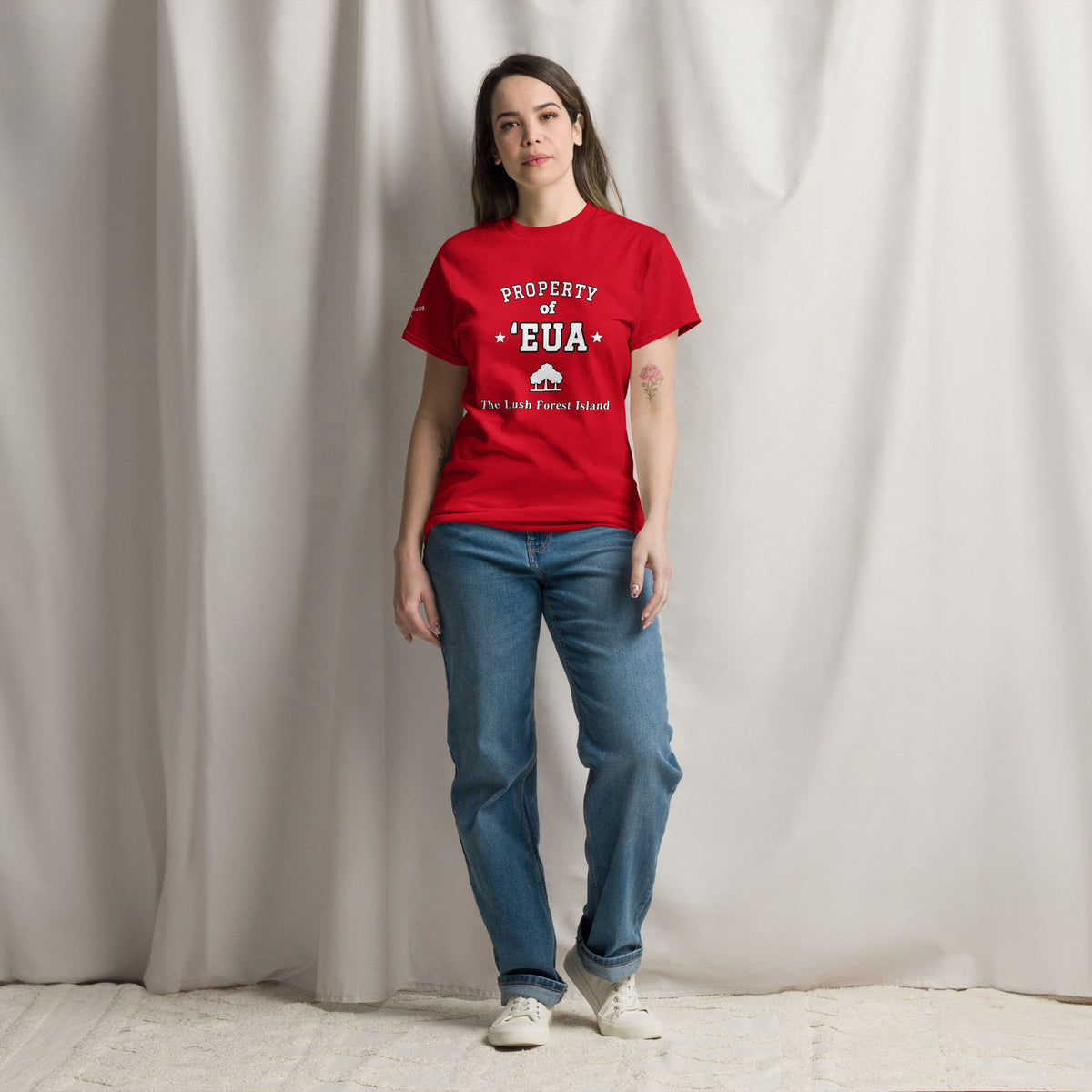 Woman wearing the red Property of 'Eua T-Shirt