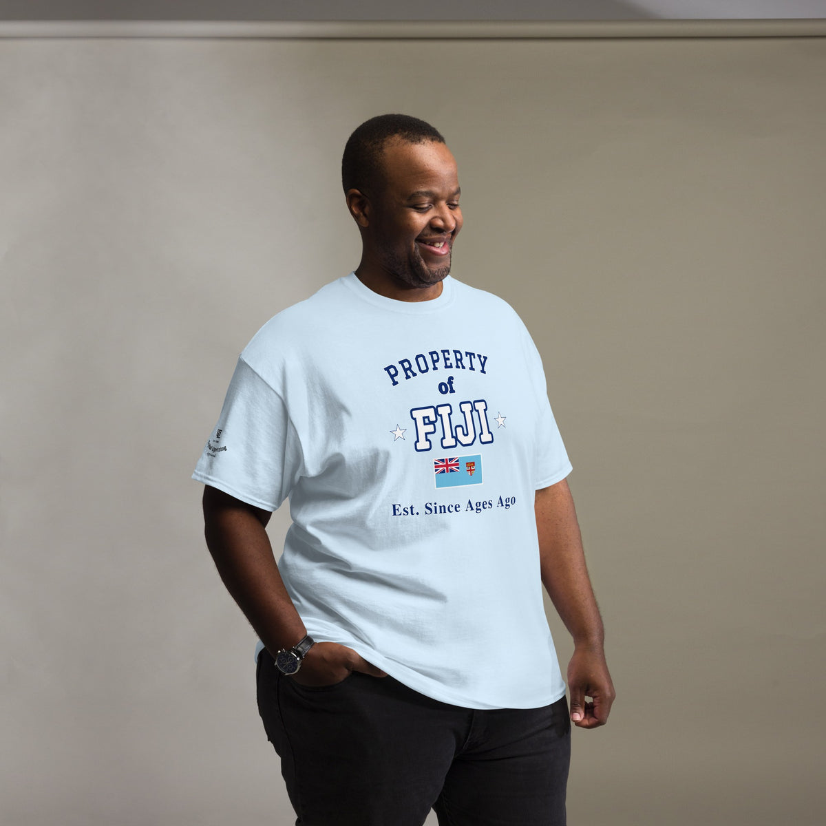 Man wearing the light blue Property of Fiji T-Shirt