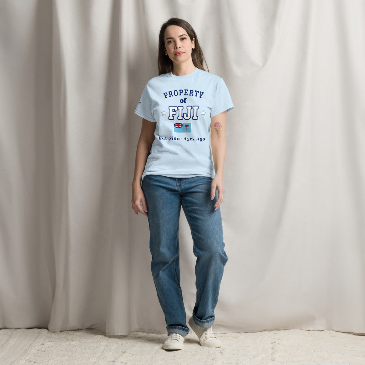 Woman wearing the light blue Property of Fiji T-Shirt