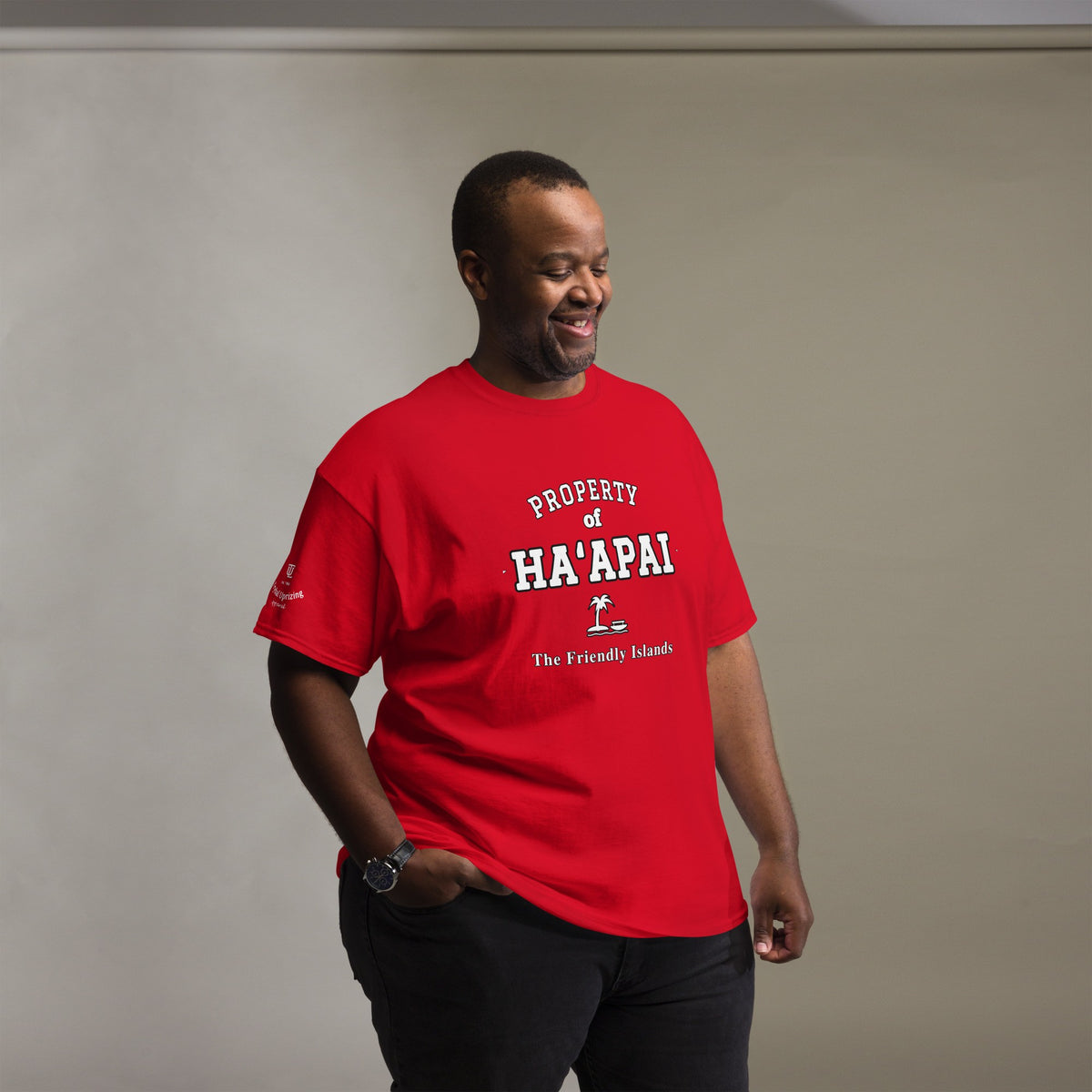 Man wearing the red Property of Ha'apai T-Shirt