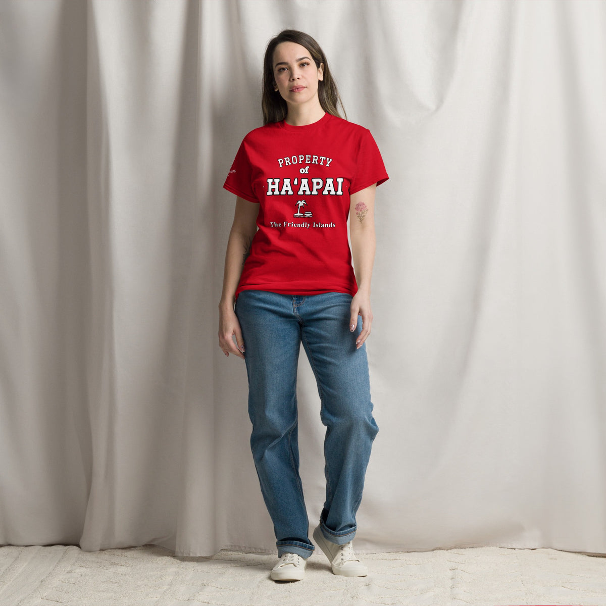 Woman wearing the red Property of Ha'apai T-Shirt