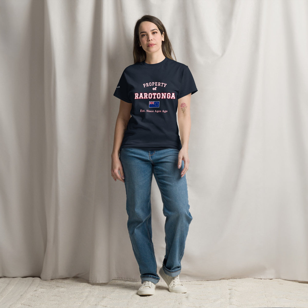 Woman wearing the navy Property of Rarotonga T-Shirt
