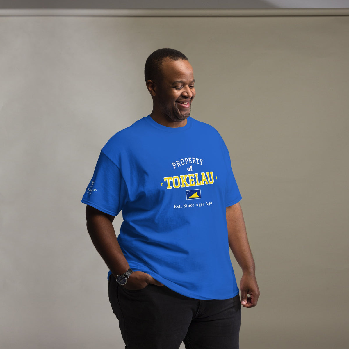 Man wearing the royal blue Property of Tokelau T-Shirt